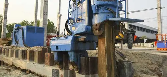 image of a hydraulic rig running a sheet piling activity for an underground construction at a site in India