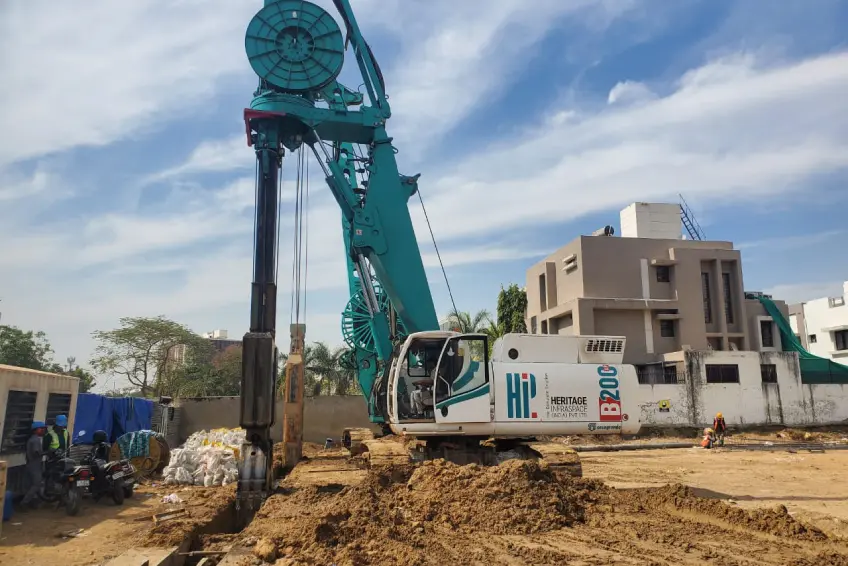 A B200 excavator removing soil from a site of diaphragm wall construction