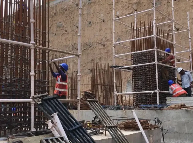 Two construction workers working on a diaphragm wall construction site