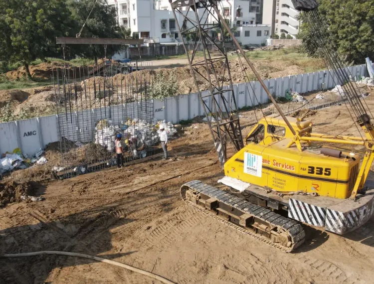 A cage wall for the diaphragm wall being lowered into an excavated area of a construction site