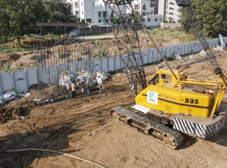 A cage wall for the diaphragm wall being lowered into an excavated area of a construction site